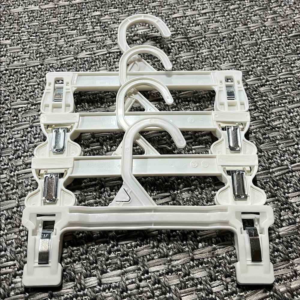 Set of Small White Plastic Pant Hangers